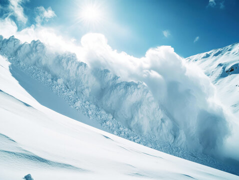 Snow avalanche cascades down a mountain slope in bright sunlight