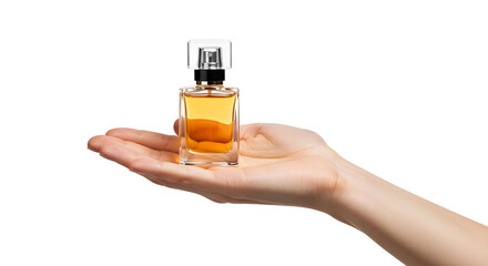 A hand holding a glass perfume bottle with liquid inside