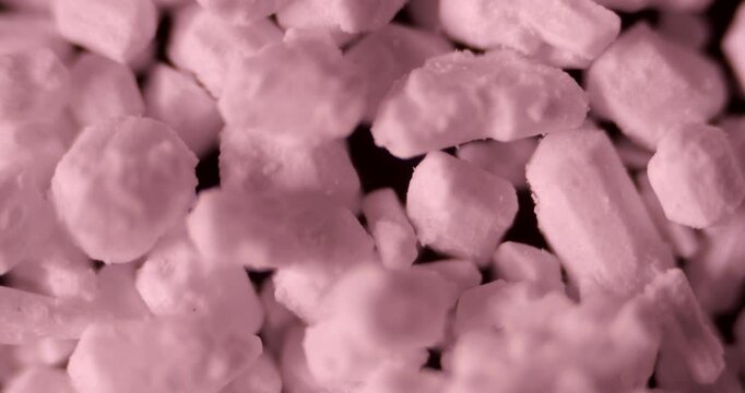 High-magnification footage revealing granular structure of sodium phosphate with industrial and scientific use cases