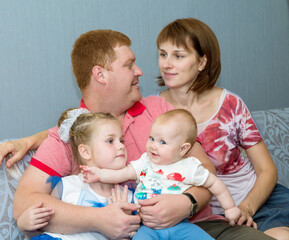 happy young family with two little girls