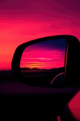 Sunset reflected in car mirror