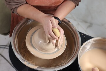 Hobby and craft. Woman making pottery indoors, closeup