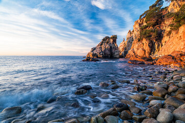 Beautiful sunrise on the coastline of the Mediterranean Sea (Cala S'Agulla, Costa Brava - Spain)