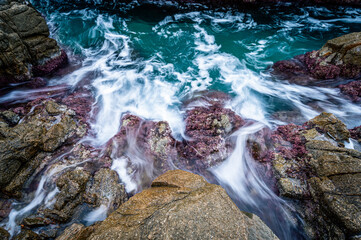 Water flowing over rocks on the coastline