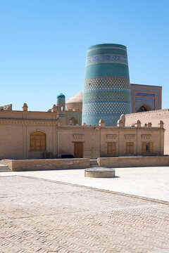 A square in the historical center of the old town of Ichan-Kala overlooking the Kalta Minar Minaret. Khiva, Uzbekistan