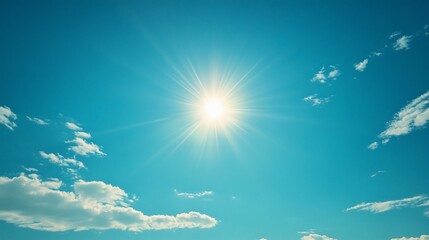 Bright sun shining through partly cloudy sky.