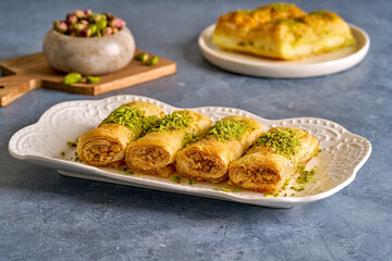 Fingers baklava with pistachio. Middle eastern  traditional sweets . Ramadan dessert	 