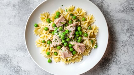 Farfalle Pasta with Tuna and Peas: A Delicious and Nutritious Meal on a White Plate, Perfect for a Gourmet Lunch or Dinner with Fresh Parmesan and Herbs.