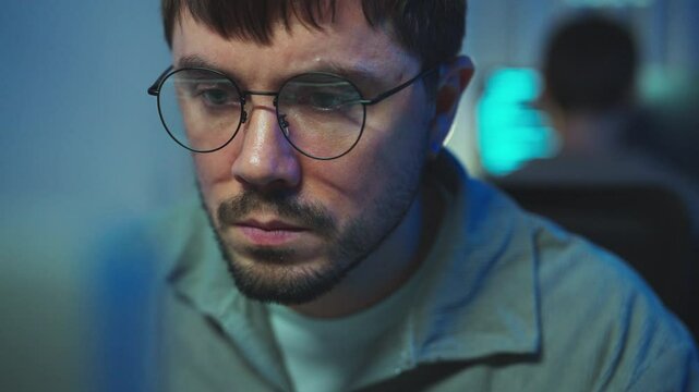 Burning the midnight oil, a programmer dives deep into code, symbolizing the relentless pursuit of innovation.