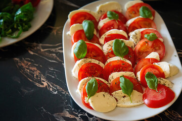 Sliced Tomato and Cheese on a Plate