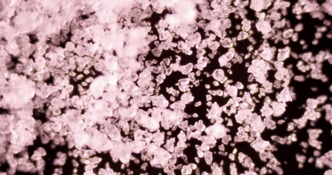 Detailed footage of Na2SO3 crystals showing rhombic structures and industrial applications in photography and food preservation