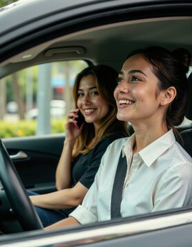 Joyful carpooling experience with two smiling women on a sunny day