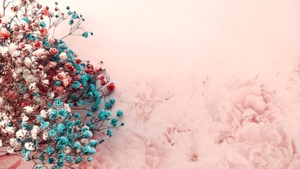 A soft pink background adorned with delicate blue and red floral accents, creating a serene and elegant composition.