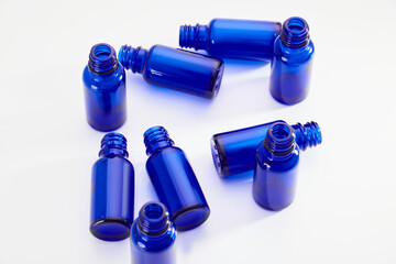 Blue glass jars without logos for mockups of medicines, vitamins, cosmetics