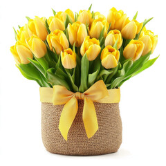 Bouquet of yellow tulips in a jute basket with a golden ribbon