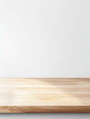 Empty wooden surface against a white wall, perfect for product placement or minimalist design