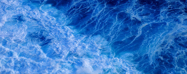 Banner Turquoise ocean sea water white wave pattern splashing deep blue sea. Banner Tropical sea...