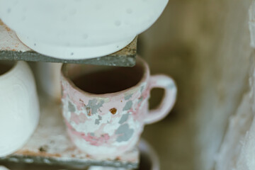 clay mugs in kiln for firing pottery