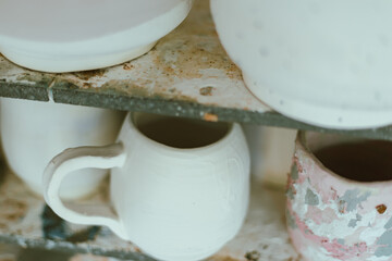 clay mugs in kiln for firing pottery