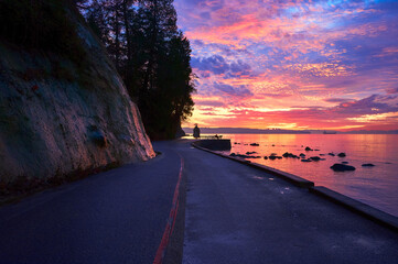 West Coast Dramatic Sunset. Sunset over the sea. Siwash Rock. Stanley Park, Vancouver, British Columbia, Canada