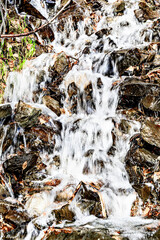 Waterfall, small water source on the slope of Lake Saint Maurice, in the Aigues Tortes National Park, Lleida	