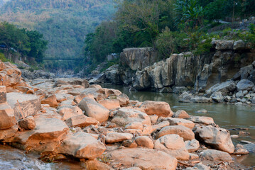 Tlawng River of Mizoram with suspended bridge and rocks all around
