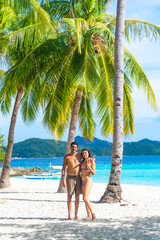 Tourists enjoying tropical vacation on malcapuya island, coron, philippines