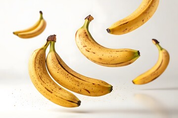 Fresh and Ripe Bananas in Motion Against a Light Background