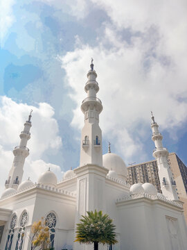 magnificent, luxurious, and Islamic exterior of the At-Thohir Mosque building against the backdrop of a clear sky with a low shooting angle