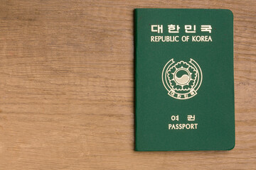 south korea passport on wooden background