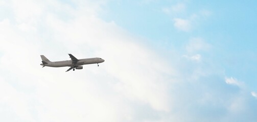 ULTRA HD. Airplane flies in blue sky. Travel. Airplane takes off against the background of blue sky.