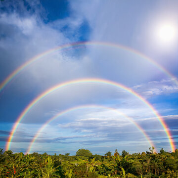 a rare triple rainbow in the sky