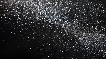 Obraz premium Silver Glitter on Black Background: A Sparkling, Elegant Texture