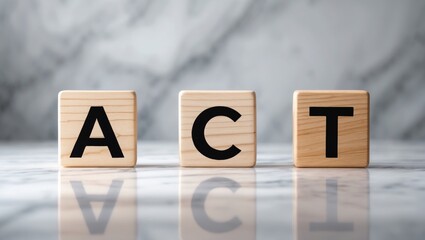 Three wooden blocks displaying ACT against an elegant white marble backdrop.