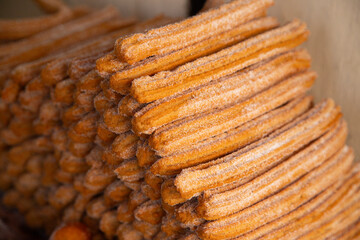 Market stall in Oaxaca with traditional sweets such as churros, donuts and meringues.