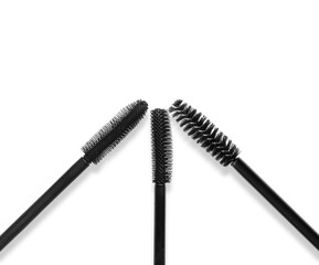 Different mascara brushes on white background, set. Top view