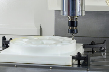 The CNC milling machine cutting the nylon parts with solid ball end mill tool.