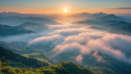 Obraz premium Fog emerging in nature over misty mountains at high altitude during a magical sunrise landscape.