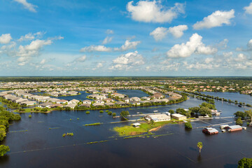 Flooding in Florida caused by tropical storm from hurricane rainfall. Farm houses in rural area...