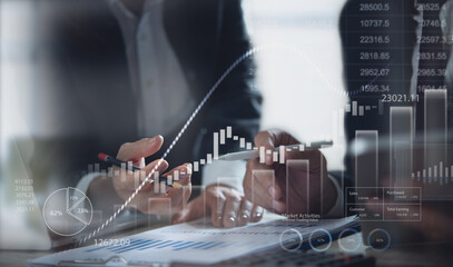Business, finance and investment concept. Business team meeting, analyzing financial report, sale data with market growth graph chart, business report and plan investment strategy