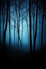 Eerie Blue Forest Landscape with Bare Trees and Dense Fog Creating a Mysterious and Tranquil Atmosphere for Nature Photography