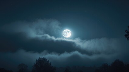 Midnight moonlight illuminating clouds in a foggy sky.