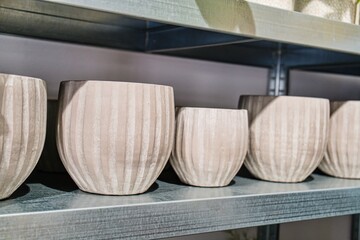 Minimalist Beige Planters on Shelf