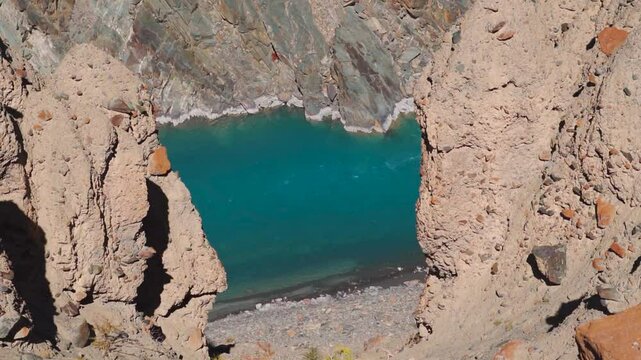 Closeup shot of blue colored Tsarap Chu river flowing in the remote areas of Zanskar as seen during the trek to Phugtal Gompa in Zanskar Valley, Ladakh, India. Blue colored river flowing in Himalayas.