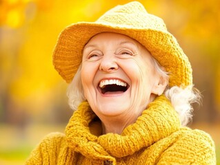 Elderly woman in bright yellow sweater and hat laughing joyfully against a golden autumn backdrop capturing warmth positivity and happiness in later years