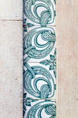 Close-up of traditional azulejo tiles on a historic facade in downtown Lisbon