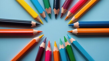 Fototapeta premium A circle is formed by a row of colored pencils, which vary in color and size, all positioned closely together. This arrangement fosters a feeling of unity.