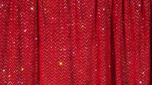 Stage curtain in glitter in theater illuminated by flashing light in 4k