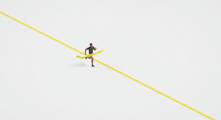 A person running toward a yellow line on a white background