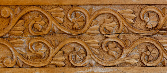 Detail of an old carved wooden door